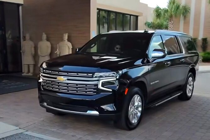 BLACK SUV MCO Airport Transportation To/From Lake Buena Vista - Riding in a Suburban or GMC with luggage